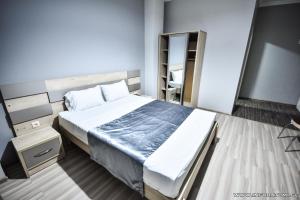 Postel nebo postele na pokoji v ubytování Hotel Wave