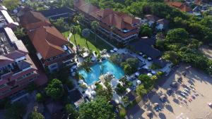 an overhead view of a large building with a swimming pool at Peninsula Beach Resort in Nusa Dua