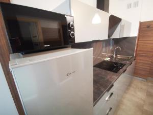 Kuchyňa alebo kuchynka v ubytovaní Apartment Cyprys 1