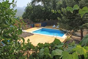a swimming pool in the middle of a yard at Casa Rural La Fresneda in Ubrique