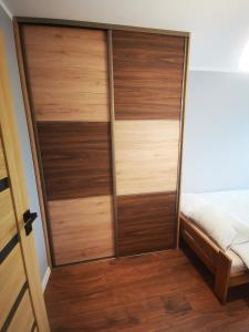 Posteľ alebo postele v izbe v ubytovaní Apartment Cyprys 1