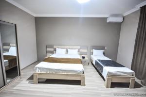 Postel nebo postele na pokoji v ubytování Hotel Wave