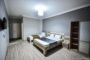 Postel nebo postele na pokoji v ubytování Hotel Wave