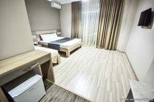 Postel nebo postele na pokoji v ubytování Hotel Wave