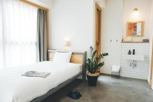 Postel nebo postele na pokoji v ubytování Hotel Noum OSAKA