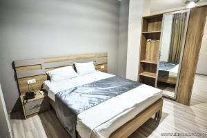 Postel nebo postele na pokoji v ubytování Hotel Wave