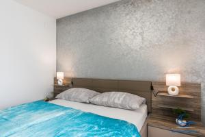 Postel nebo postele na pokoji v ubytování Apartments Vila DK
