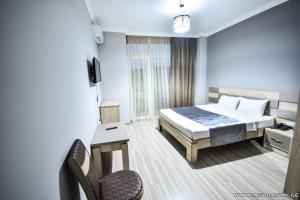 Postel nebo postele na pokoji v ubytování Hotel Wave