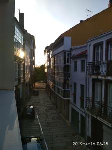 a view of an alley with buildings at Km 0 Camiño Ingles Benito Vicetto, 14 in Ferrol
