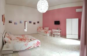 A bed or beds in a room at L'Opera dei Pupi B&b