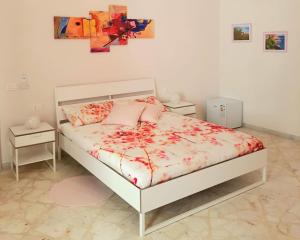 A bed or beds in a room at L'Opera dei Pupi B&b