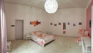 A bed or beds in a room at L'Opera dei Pupi B&b