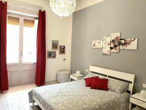 A bed or beds in a room at L'Opera dei Pupi B&b