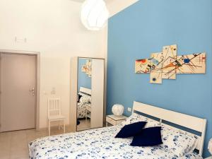 A bed or beds in a room at L'Opera dei Pupi B&b