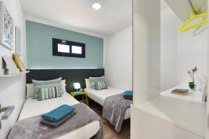Postel nebo postele na pokoji v ubytování Cozy bungalow for 6 in Playa del Inglés GD04 by VillaGranCanaria + 24 fotografií