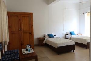 Postel nebo postele na pokoji v ubytování Zhim Zhim Guest House