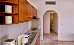 A kitchen or kitchenette at Aspri Petra Apartments