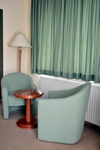 Postel nebo postele na pokoji v ubytování Hotel Mladimir