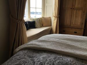 A bed or beds in a room at Seaham