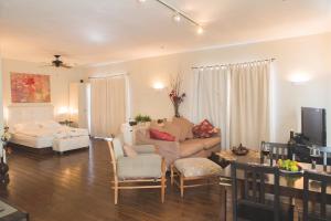 a living room with a couch and a table at Roof Of The Galilee in Amirim