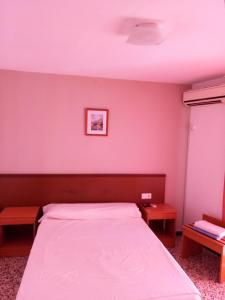 Postel nebo postele na pokoji v ubytování Hotel Iris