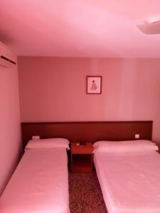 Postel nebo postele na pokoji v ubytování Hotel Iris