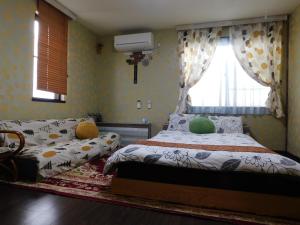 Postel nebo postele na pokoji v ubytování Guesthouse Shang
