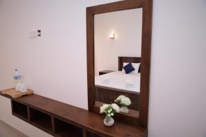 Voodi või voodid majutusasutuse The Ritz Hikkaduwa toas