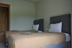 Postel nebo postele na pokoji v ubytování Hastina Hotel Lombok