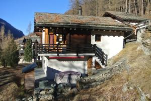 a small house on the side of a hill at Chalet Mischabel in Saas-Grund