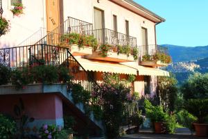 a building with flower boxes on the balconies at Casale degli Ulivi in Roccadaspide