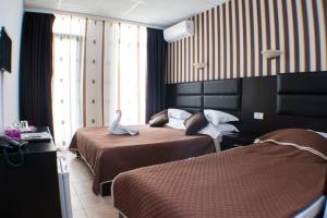 Postel nebo postele na pokoji v ubytování Hotel Solea Beach
