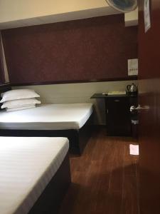 Rúm í herbergi á Hang Ho Hostel