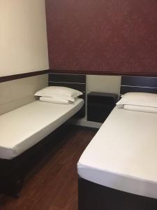 Rúm í herbergi á Hang Ho Hostel