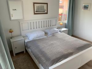 Postel nebo postele na pokoji v ubytování Ferienwohnung Holstenstern