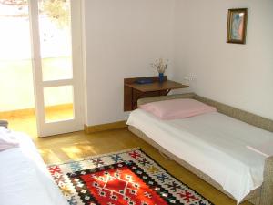 Postel nebo postele na pokoji v ubytování Apartments Polic