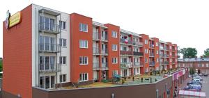 a row of apartment buildings on a city street at 2-Room Apartment in Nowy Dwór Mazowiecki