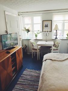 TV a/nebo společenská místnost v ubytování Ebeltoft Midtby + 19 fotografií