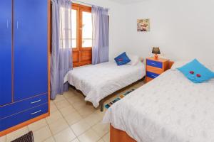 Postel nebo postele na pokoji v ubytování Arrecife Azul