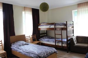 Ліжко або ліжка в номері HQ of Nove Sujashvili