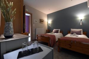 Posteľ alebo postele v izbe v ubytovaní Tassos Rooms