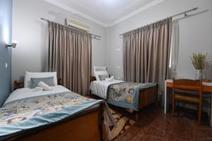 Posteľ alebo postele v izbe v ubytovaní Tassos Rooms