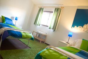 Ein Bett oder Betten in einem Zimmer der Unterkunft Casa Do Castelo