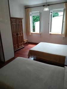Postel nebo postele na pokoji v ubytování HOSTAL RESIDENCIA PRESIDENTE