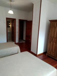 Postel nebo postele na pokoji v ubytování HOSTAL RESIDENCIA PRESIDENTE