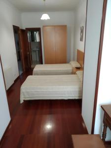 Postel nebo postele na pokoji v ubytování HOSTAL RESIDENCIA PRESIDENTE