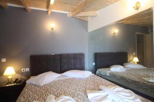 Ένα ή περισσότερα κρεβάτια σε δωμάτιο στο Hotel Pegasos