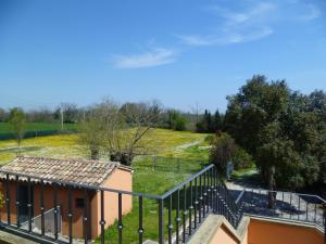 a staircase leading to a house with a fence at Appartamento in villa in Fano