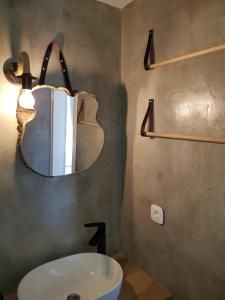 a bathroom with a sink and a mirror at Εn Kanalion in Kanália +60 photos