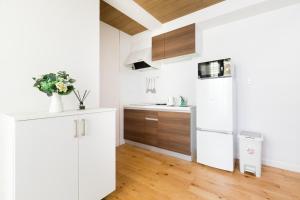 Cucina o angolo cottura di サンライズハワイ